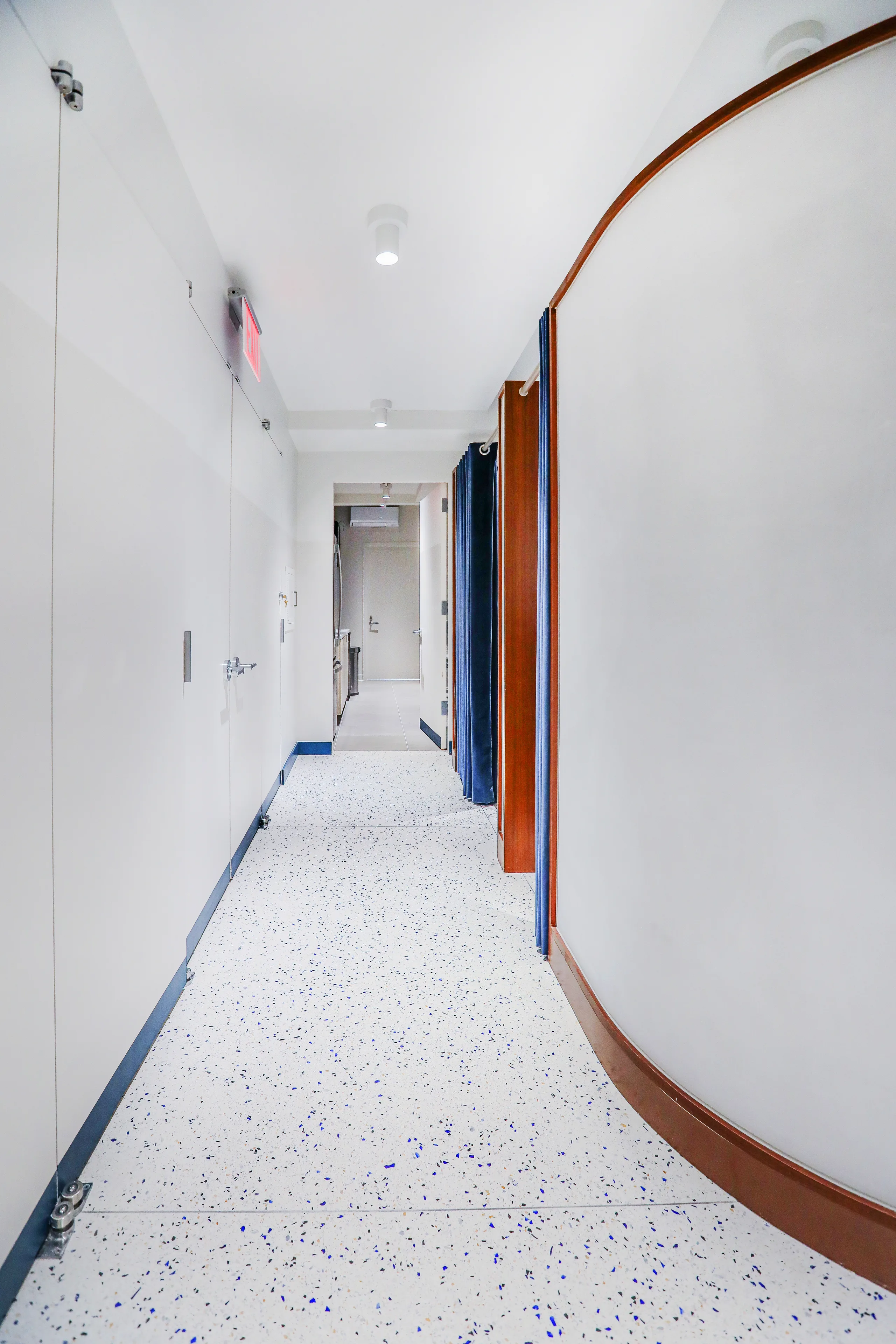 AETHOS interior detail with softly lit finishes and clinical millwork