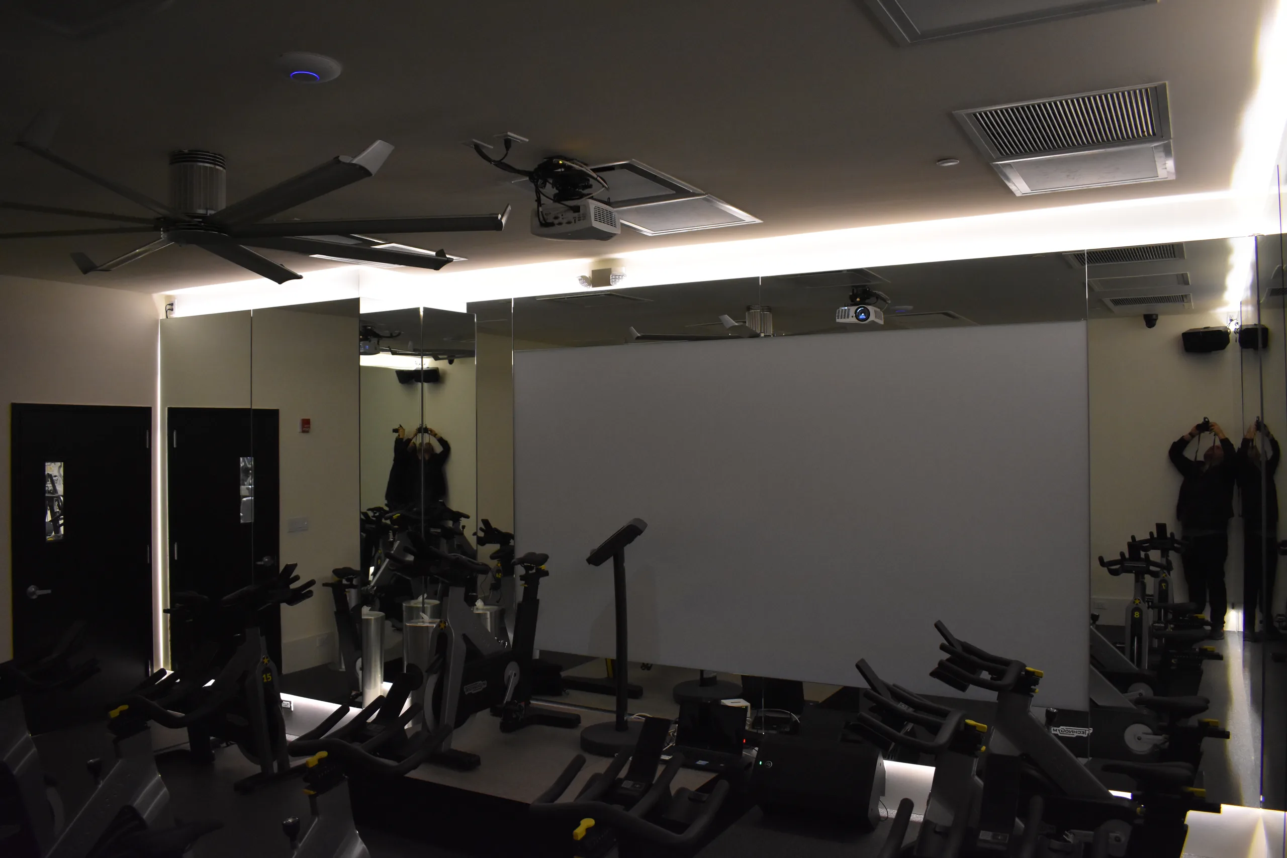 Goal Mine Health Club cycling studio with mirrored wall and integrated lighting